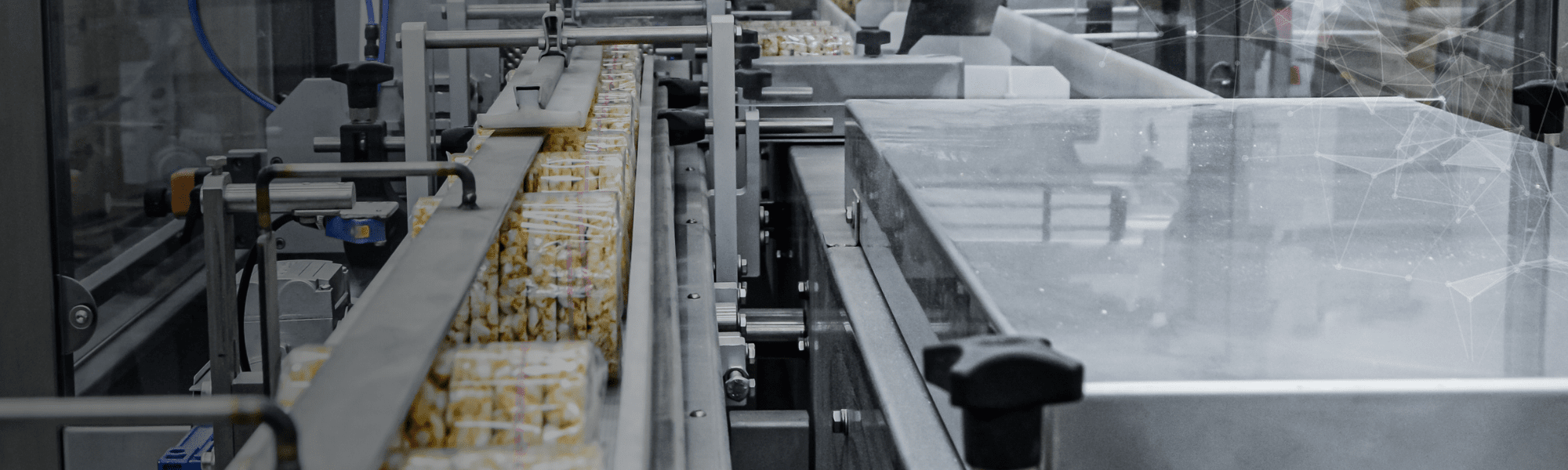 Engineer working on automated production line in a UK food manufacturing facility