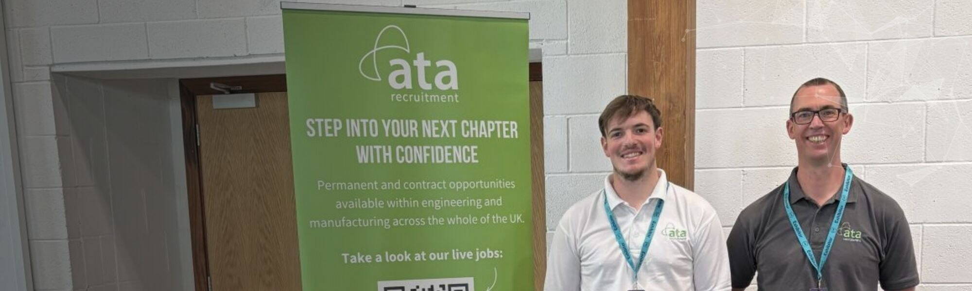 Two people standing in front of an ATA Recruitment Forces banner at a recruitment event, engaging with visitors about career opportunities for ex forces professionals.