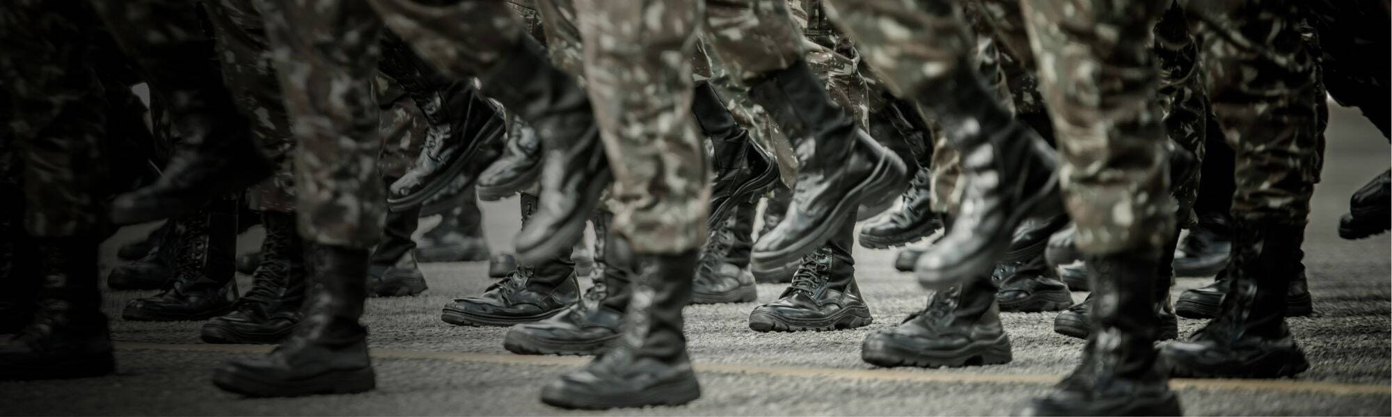 Ex-military personnel marching in uniform, representing transition from armed forces to engineering careers